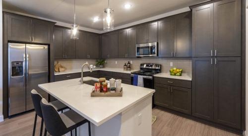 One Bedroom Apartment Rentals in Spring, TX -Model Kitchen with Island Breakfast Bar