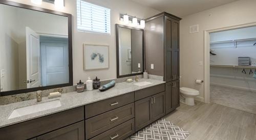 Two Bedroom Apartment Rentals in Spring, TX - Model Bathroom with Granite Countertops and Framed Mirrors & Large Walk-In Closet 