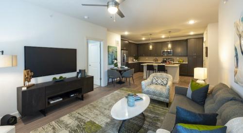 One Bedroom Apartment Rentals in Spring, TX - Model Living Room with View to Kitchen